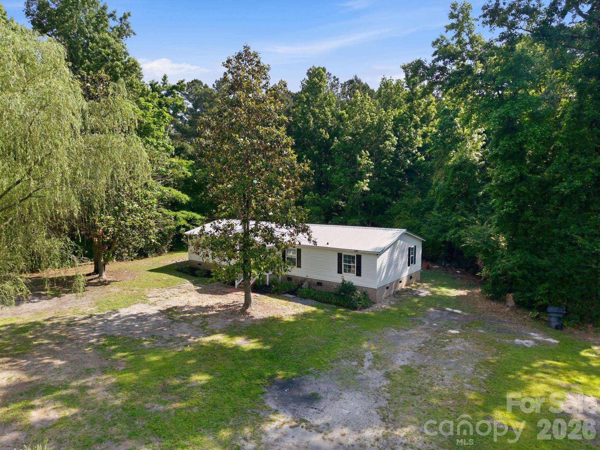 481 Harrell Road Burgaw, NC 28425 - Photo 20 of 25 a view of a house with yard and sitting area
