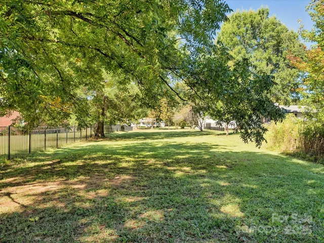 a view of outdoor space with trees all around