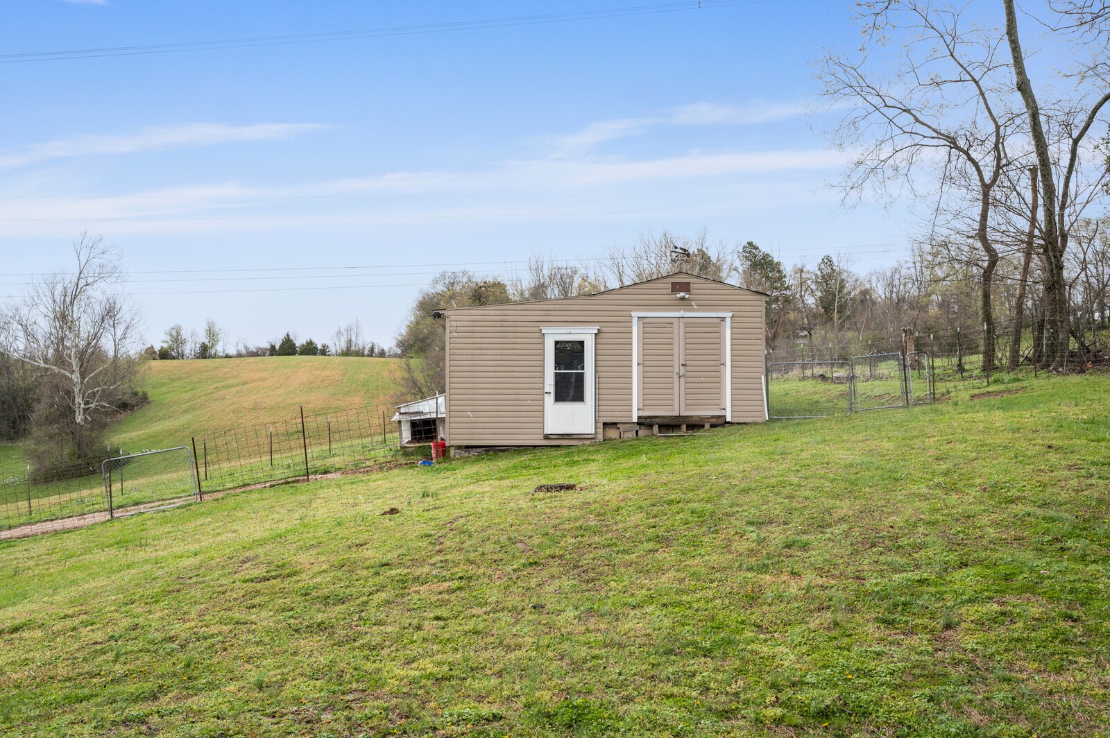 6388 Franklin Road Lebanon, TN 37090 - Photo 25 of 27 a backyard of a house with lots of green space and fog