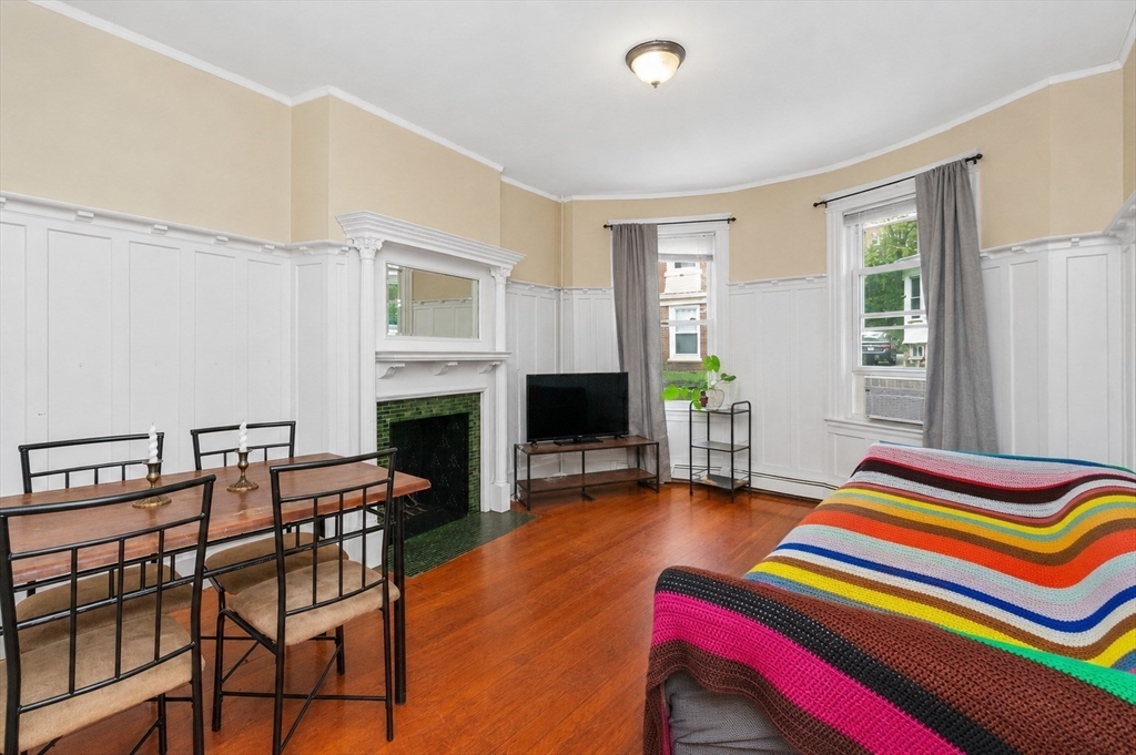 8 Colliston Road Boston, MA 02135 - Photo 13 of 40 a living room with furniture and a fireplace
