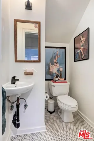 a bedroom with a bed chair and a window