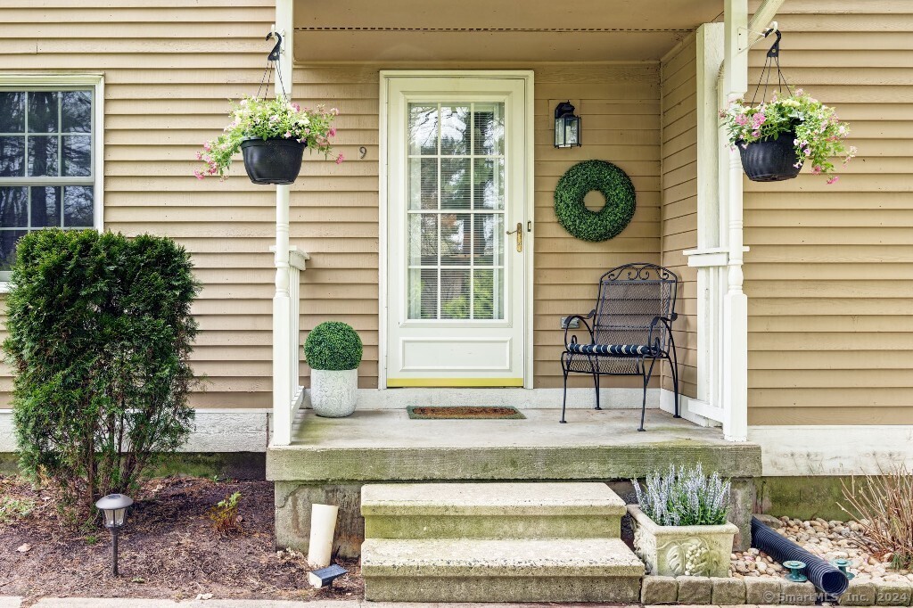 697 South End Road, Unit 9 Southington, CT 06479 - Photo 1 of 1 a view of a house with a balcony and a potted plant