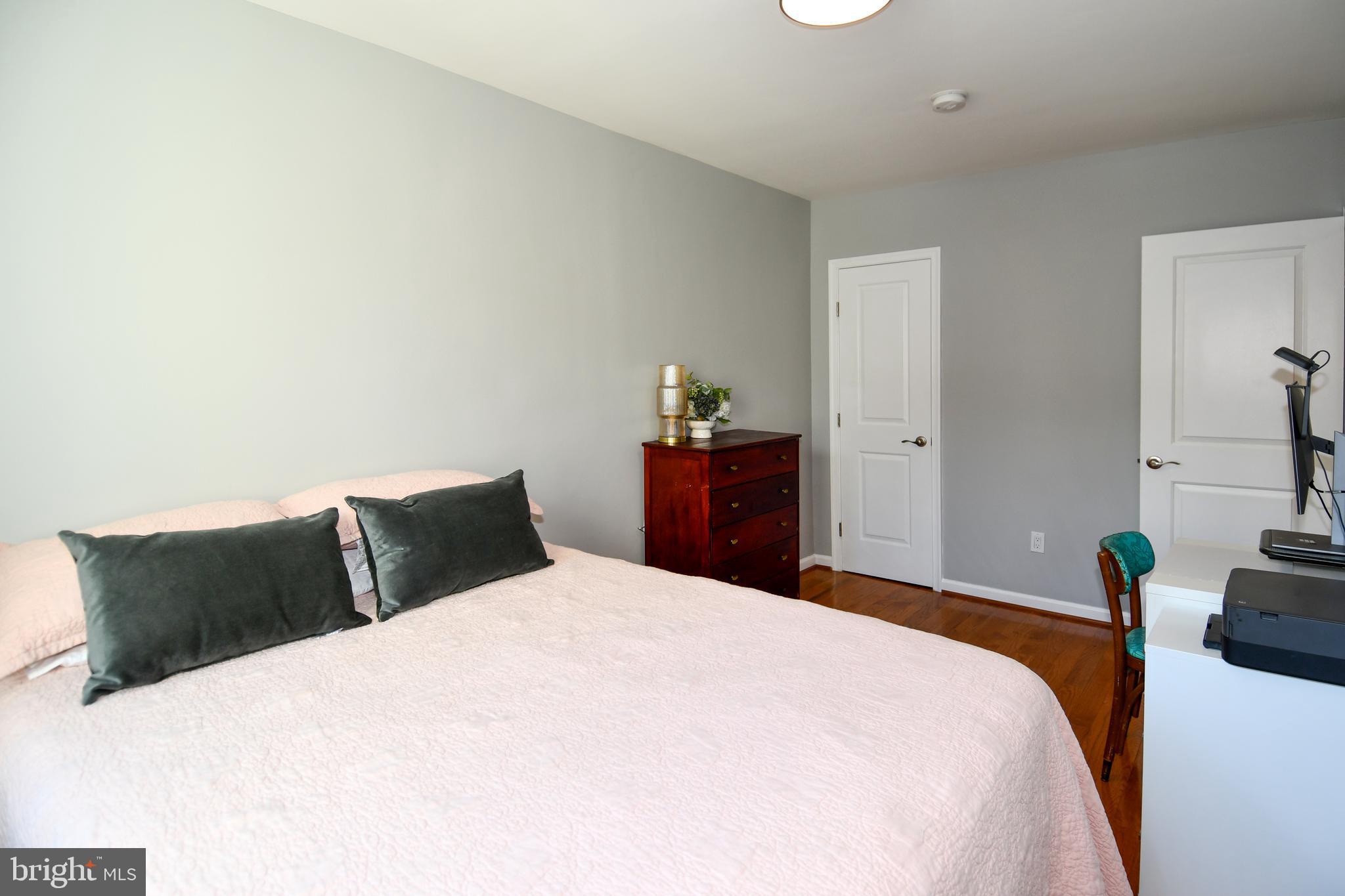 1643 Montello Avenue Northeast, Unit 4 Washington, DC 20002 - Photo 13 of 30 a bedroom with a bed and a television