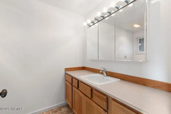 a white toilet sitting next to a bath tub