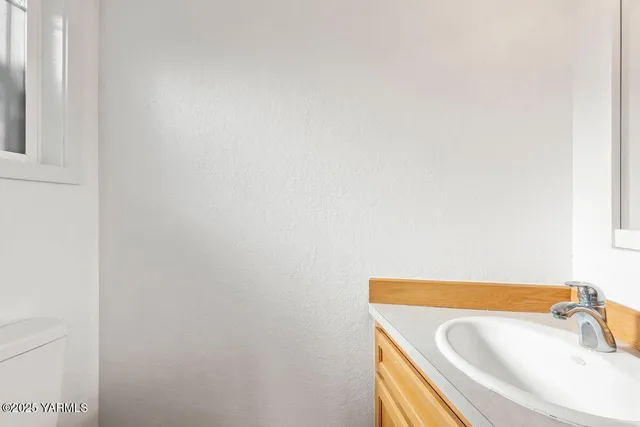 a bathroom with a tub and sink