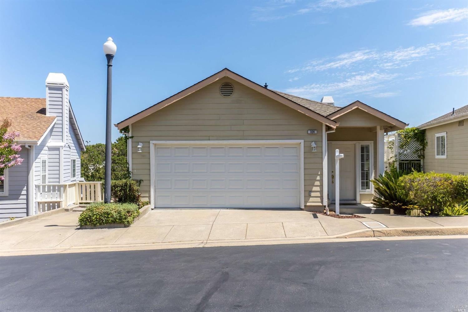 324 Sterling Way San Rafael, CA 94903 - Photo 1 of 1 a front view of a house with a yard and garage