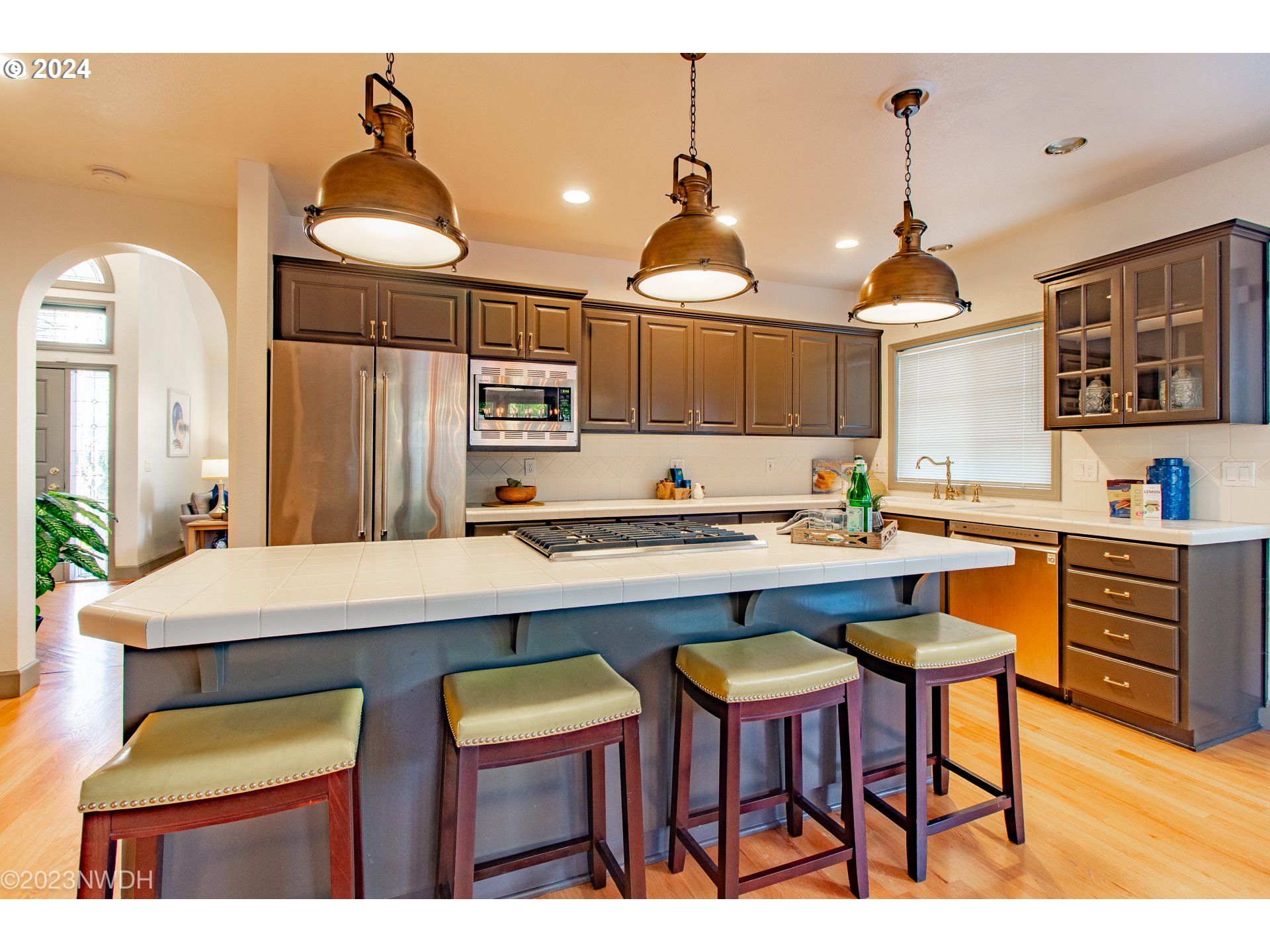 3435 Hampton Way Eugene, OR 97401 - Photo 14 of 46 a kitchen with a sink a stove and chairs