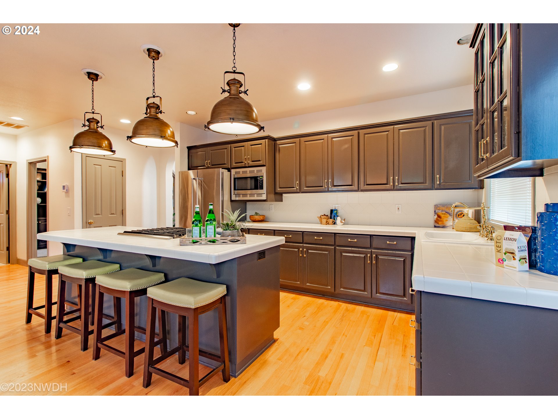 3435 Hampton Way Eugene, OR 97401 - Photo 15 of 46 a kitchen with stainless steel appliances granite countertop a sink a stove and a wooden floors