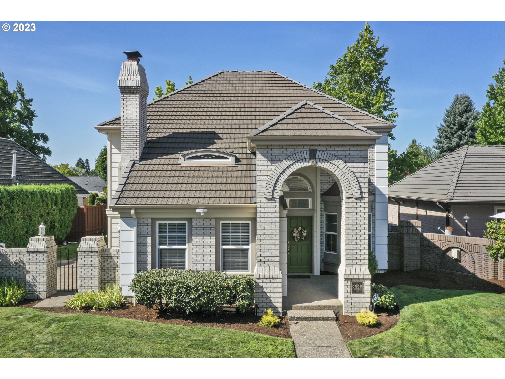 3435 Hampton Way Eugene, OR 97401 - Photo 2 of 46 a front view of a house with garden
