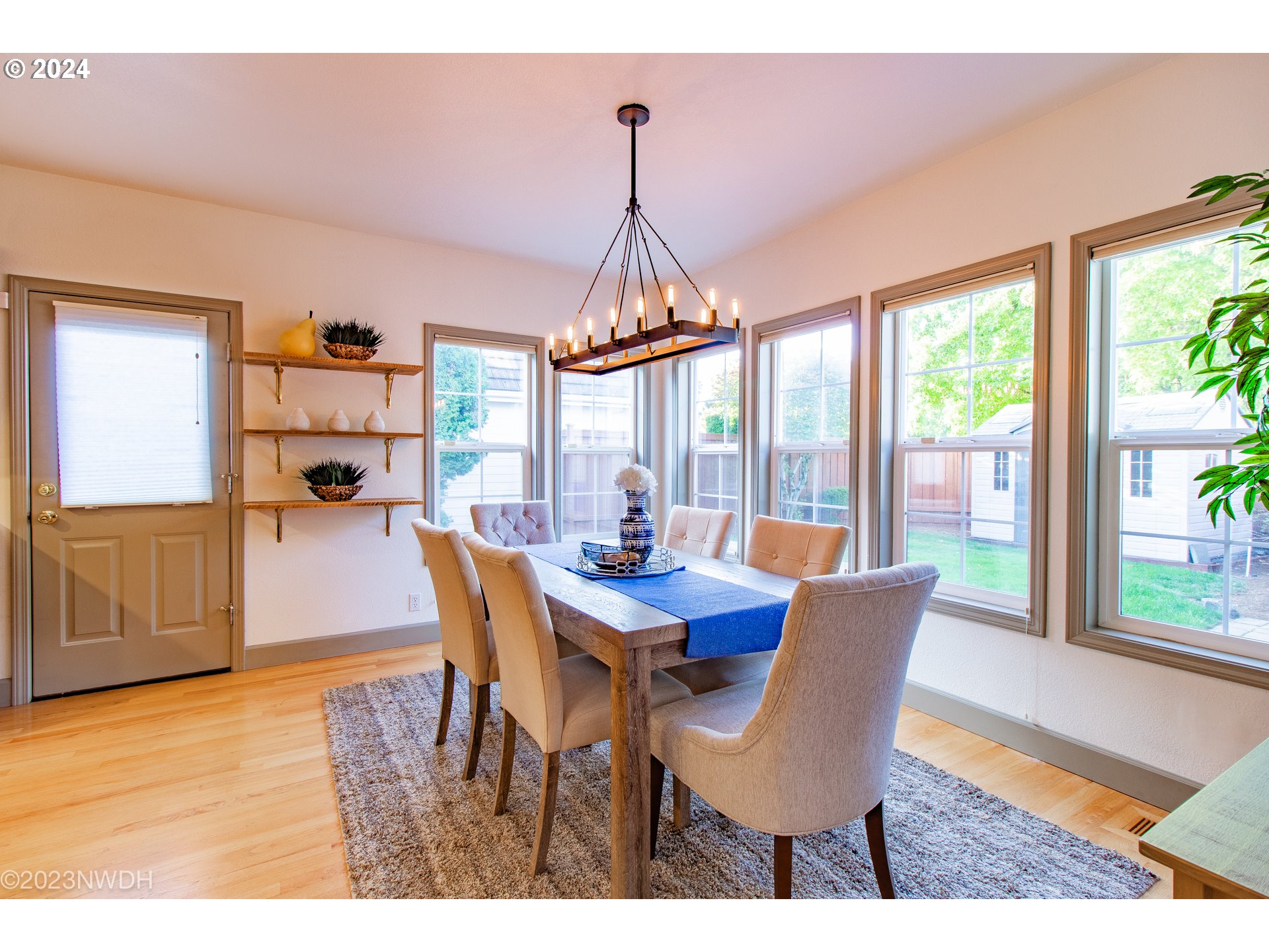 3435 Hampton Way Eugene, OR 97401 - Photo 22 of 46 a view of a dining room with furniture window and wooden floor