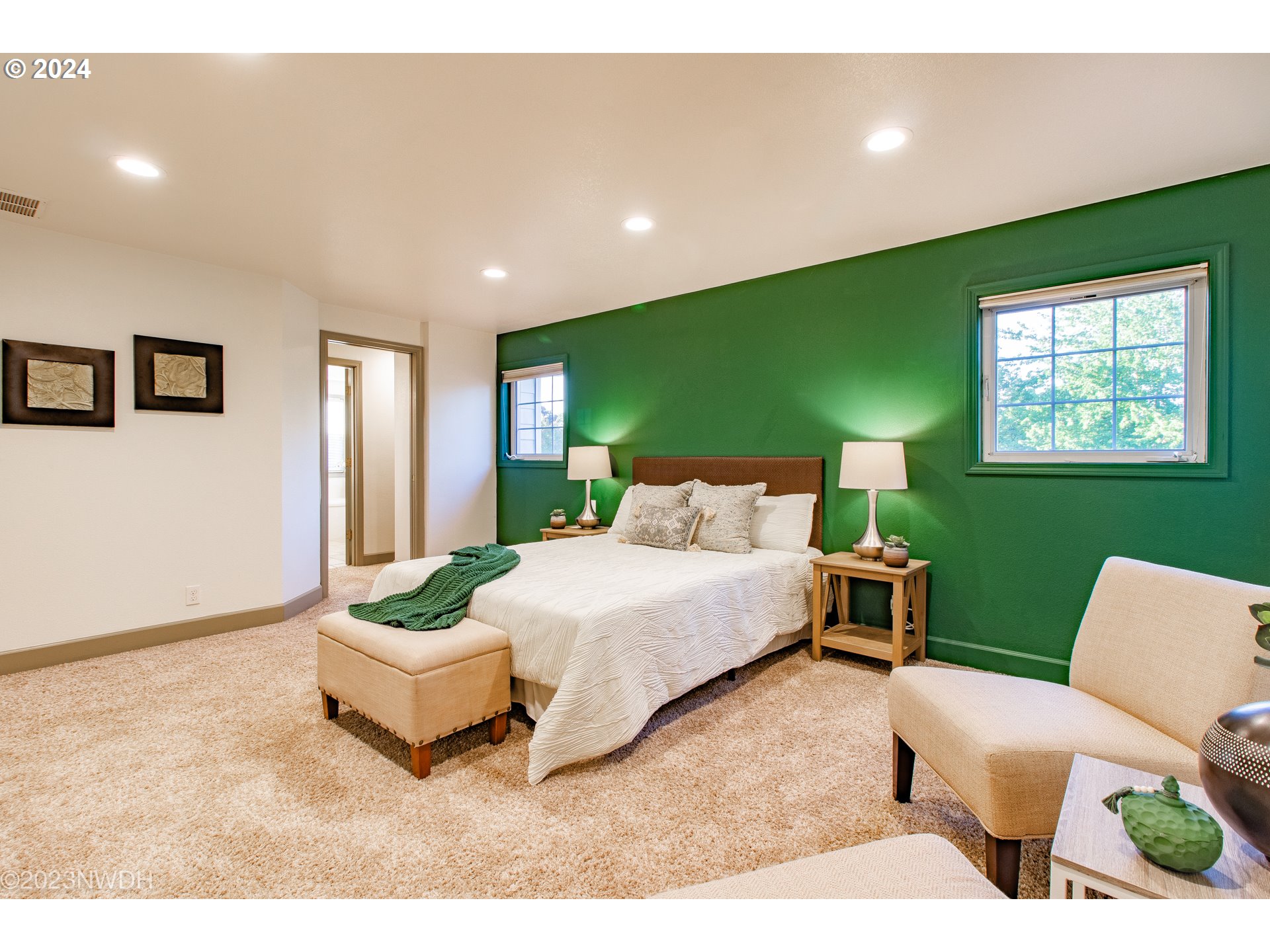 3435 Hampton Way Eugene, OR 97401 - Photo 27 of 46 a spacious bedroom with a bed and a couch