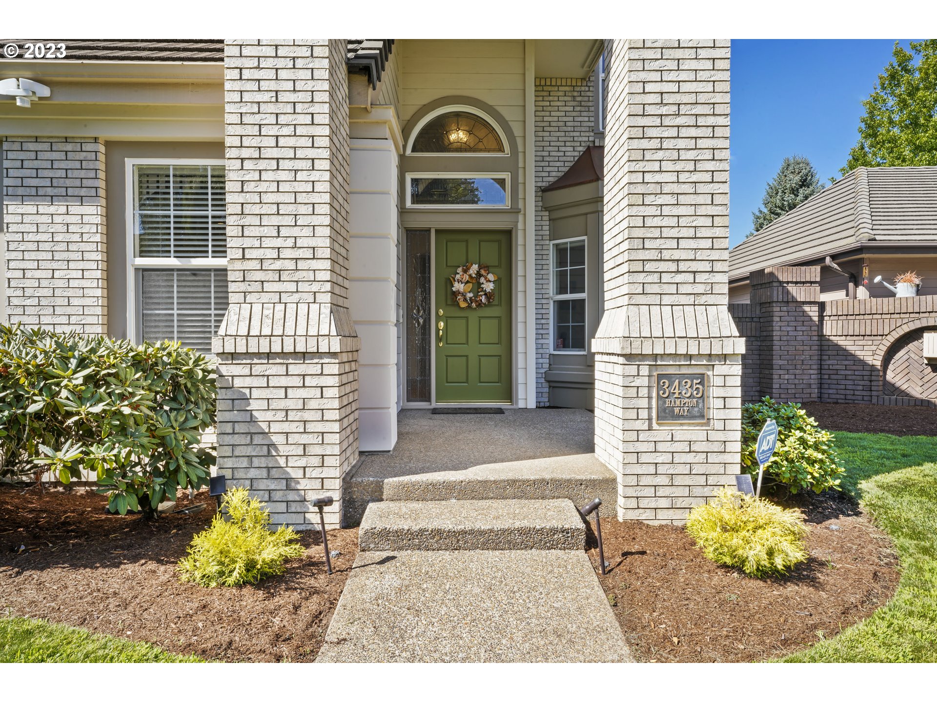 3435 Hampton Way Eugene, OR 97401 - Photo 3 of 46 a front view of a house with a garden