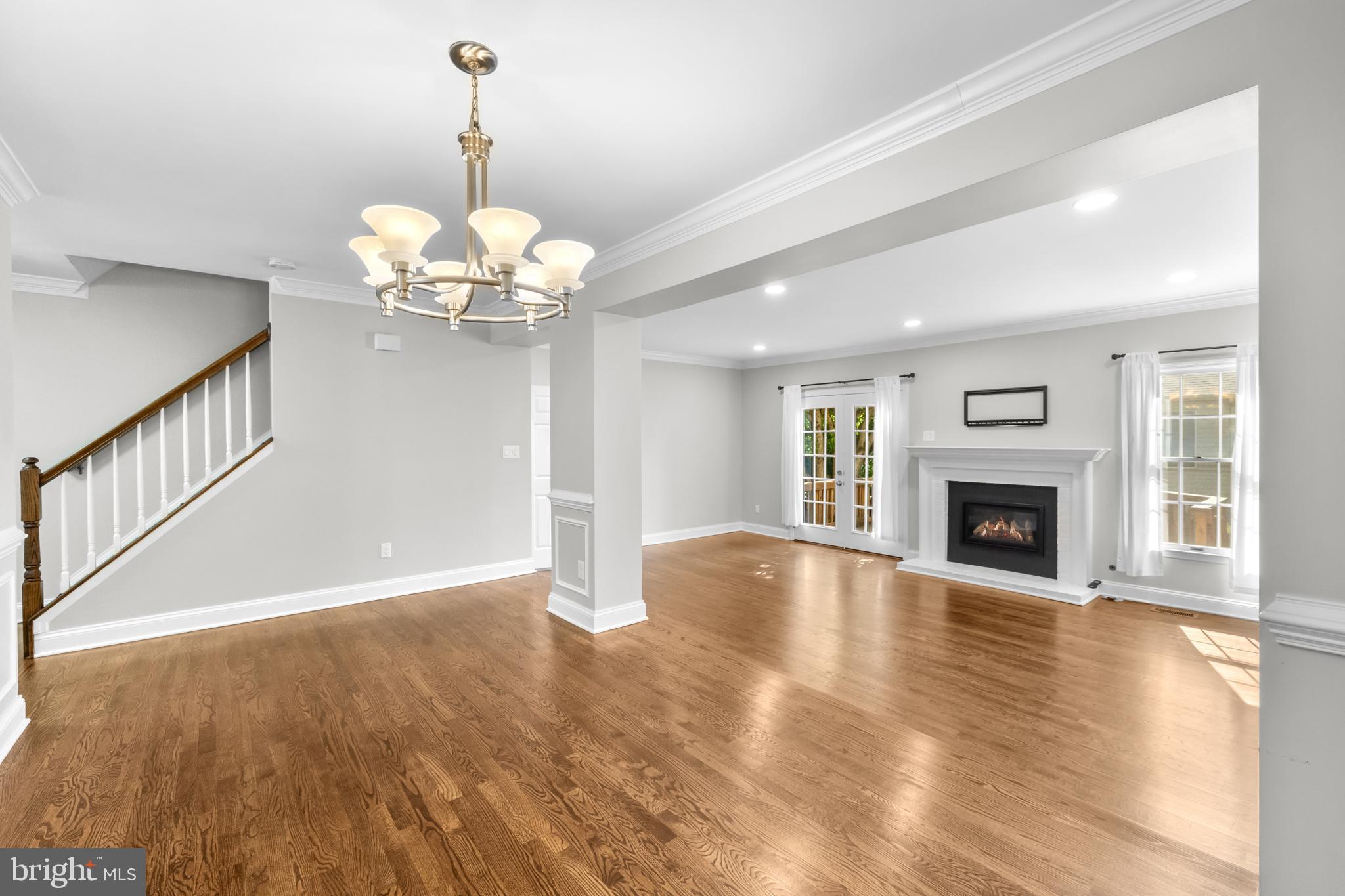 6491 Milva Lane Springfield, VA 22150 - Photo 6 of 59 Living room with large windows and gas fireplace