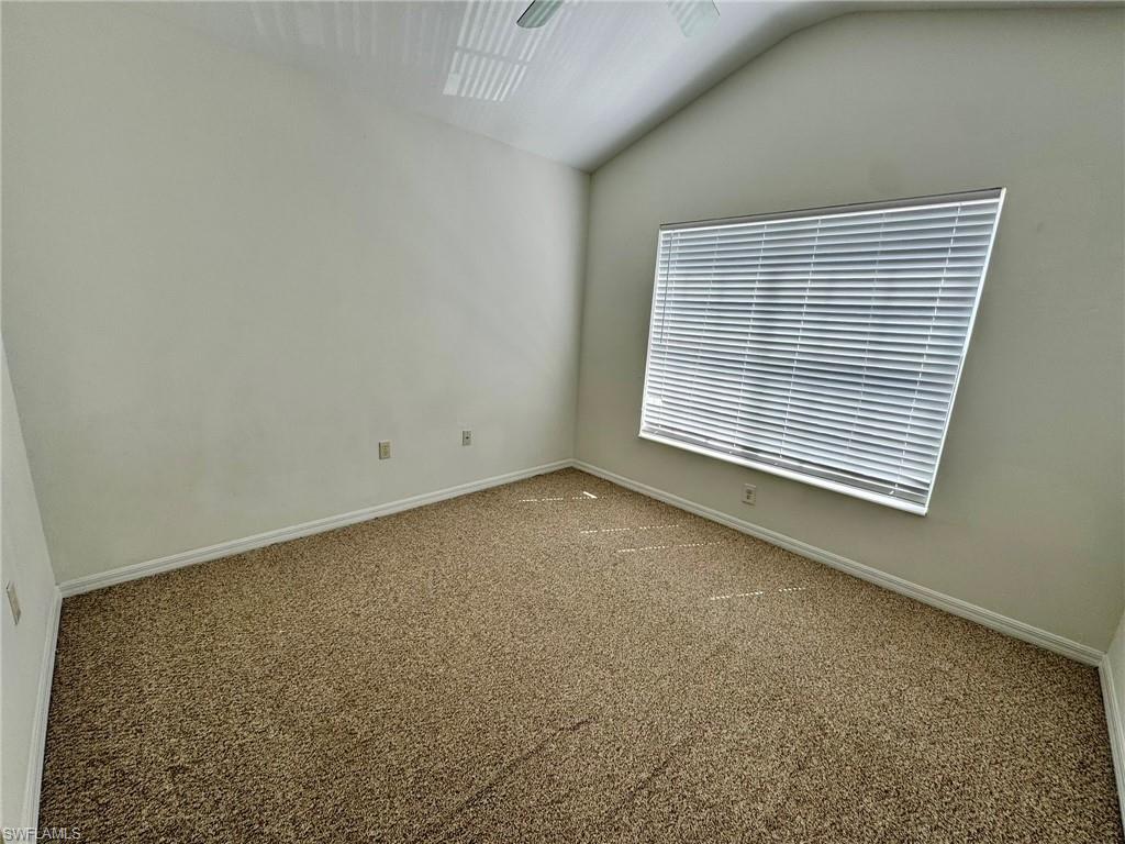 860 Hampton Circle, Unit 165 Naples, FL 34105 - Photo 26 of 38 an empty room with a window