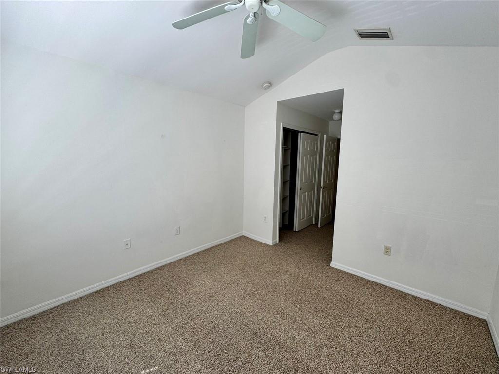 860 Hampton Circle, Unit 165 Naples, FL 34105 - Photo 27 of 38 a view of an empty room with closet area