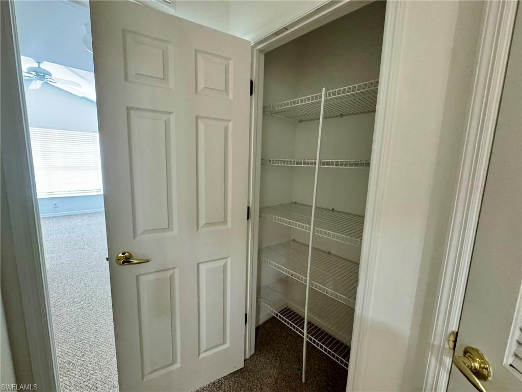 860 Hampton Circle, Unit 165 Naples, FL 34105 - Photo 28 of 38 a bathroom with a shower