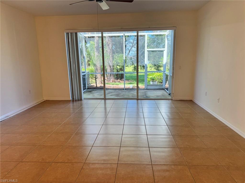 860 Hampton Circle, Unit 165 Naples, FL 34105 - Photo 5 of 38 a view of an empty room and window