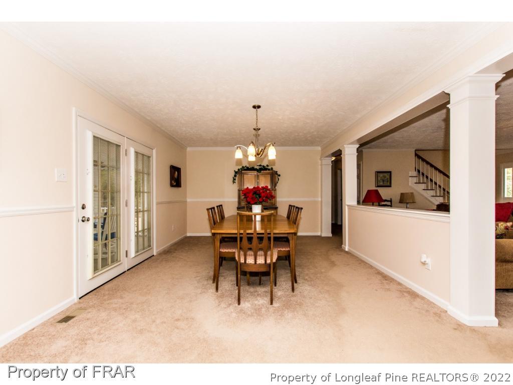 6313 Faircloth Bridge Road Stedman, NC 28391 - Photo 7 of 36 a dining room with furniture and window