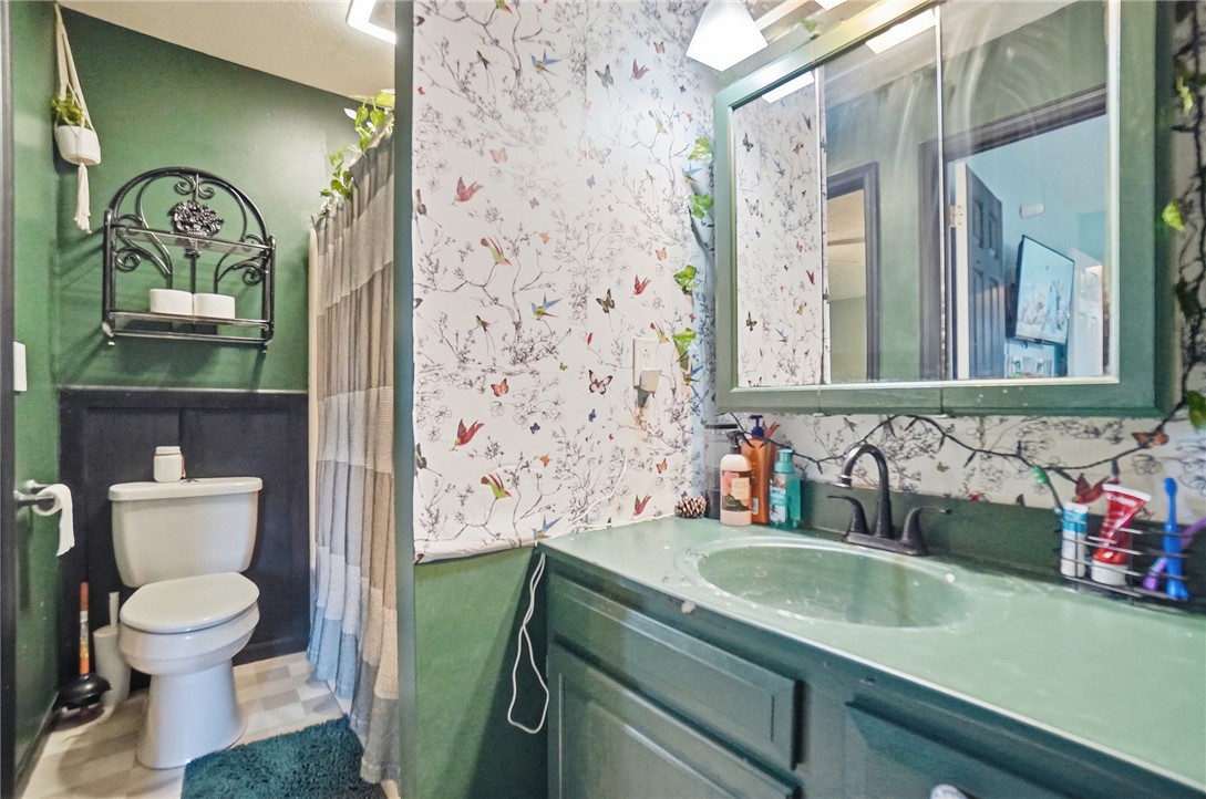5209 North Addison New Carlisle Road St. Paris, OH 43072 - Photo 34 of 47 This bathroom features a functional vanity with ample storage and a convenient shower area.