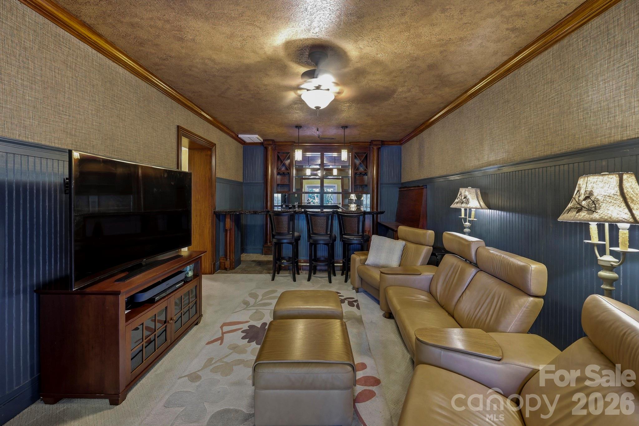 151 Garner Road Lake Lure, NC 28746 - Photo 25 of 48 a living room with furniture and a flat screen tv
