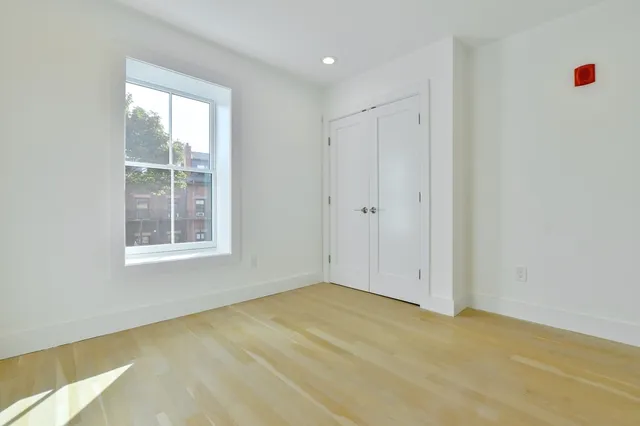 a view of an empty room with a window