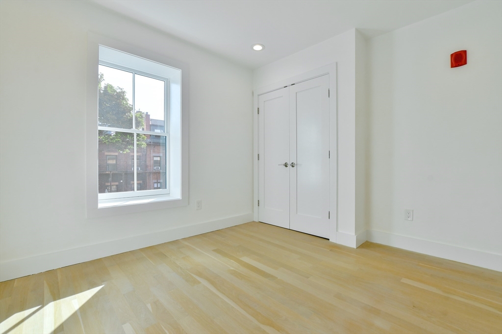 55 East Springfield Street, Unit 4 Boston, MA 02118 - Photo 13 of 16 a view of an empty room with a window