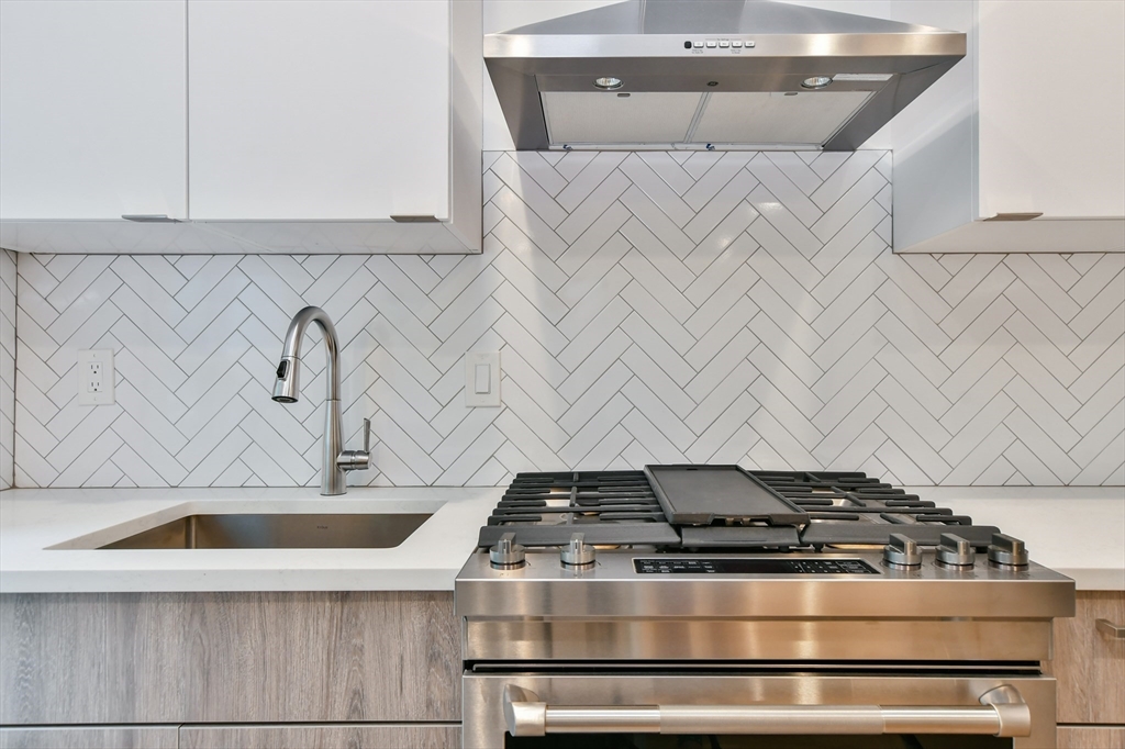 55 East Springfield Street, Unit 4 Boston, MA 02118 - Photo 8 of 16 a stove top oven sitting inside of a kitchen