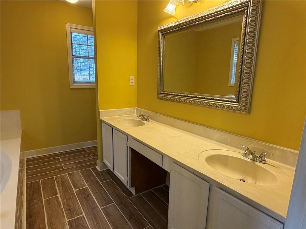 4608 Warners Trail Norcross, GA 30093 - Photo 16 of 23 a bathroom with a sink and a mirror