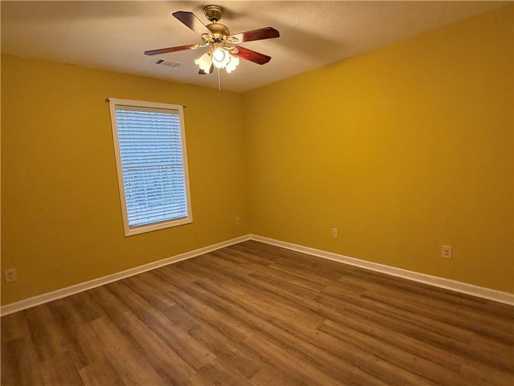 4608 Warners Trail Norcross, GA 30093 - Photo 20 of 23 a view of empty room with wooden floor and fan
