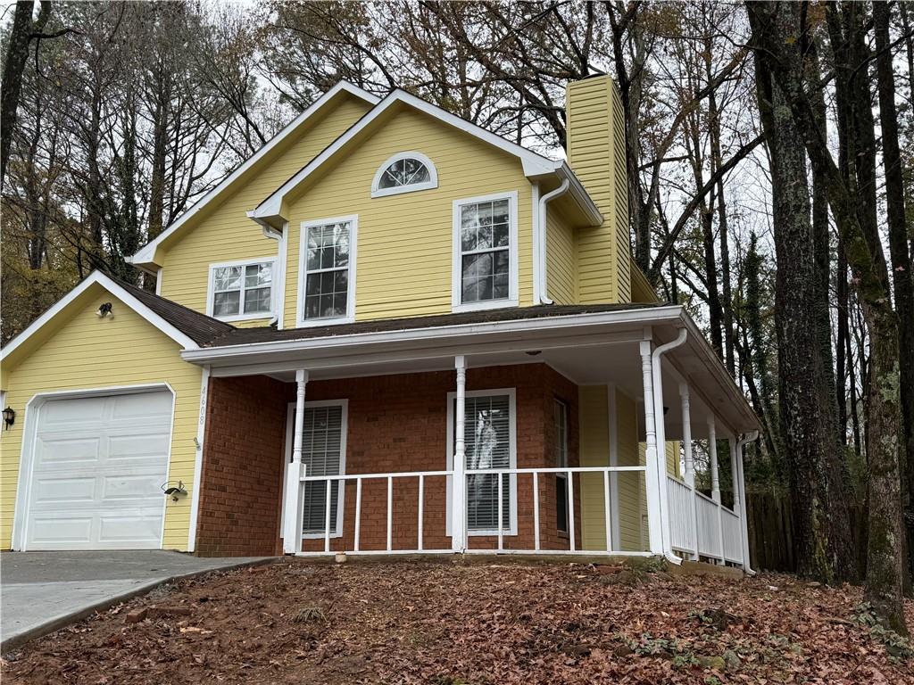 4608 Warners Trail Norcross, GA 30093 - Photo 2 of 23 a front view of a house with a garden
