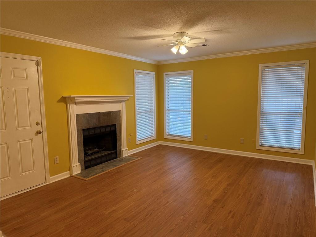 4608 Warners Trail Norcross, GA 30093 - Photo 6 of 23 a view of an empty room with a fireplace and a window