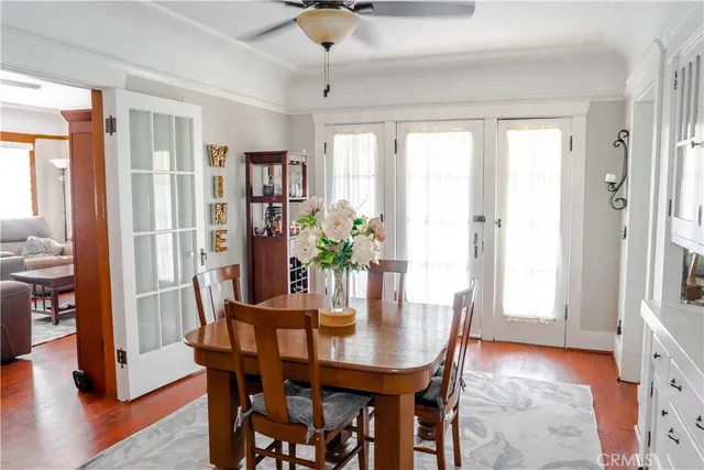 a kitchen with granite countertop white cabinets stainless steel appliances and a sink