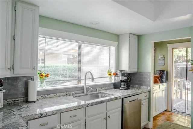 a kitchen with a stove and a refrigerator