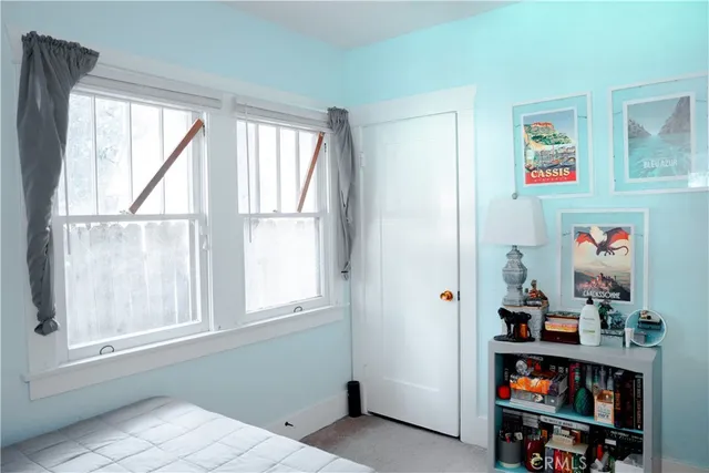 a bathroom with a toilet and a mirror