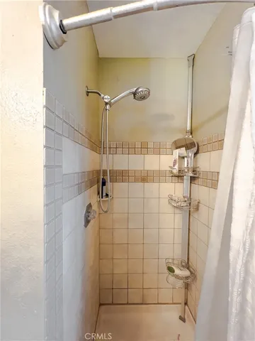 a wooden bench sitting in front of a building