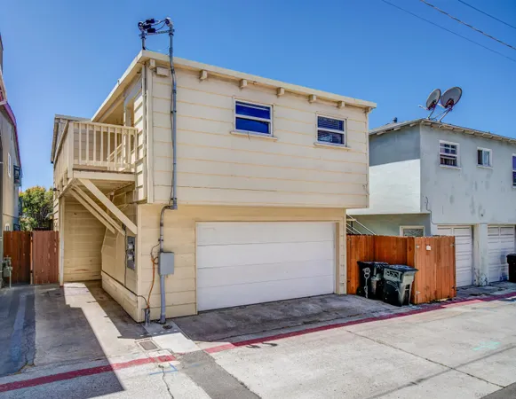 a front view of a house with garage