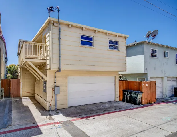 a front view of a house with garage