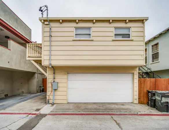 a front view of a house with garage