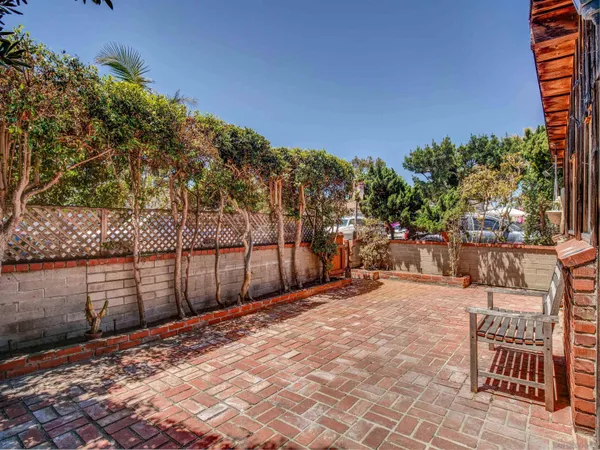 a view of a backyard with sitting area