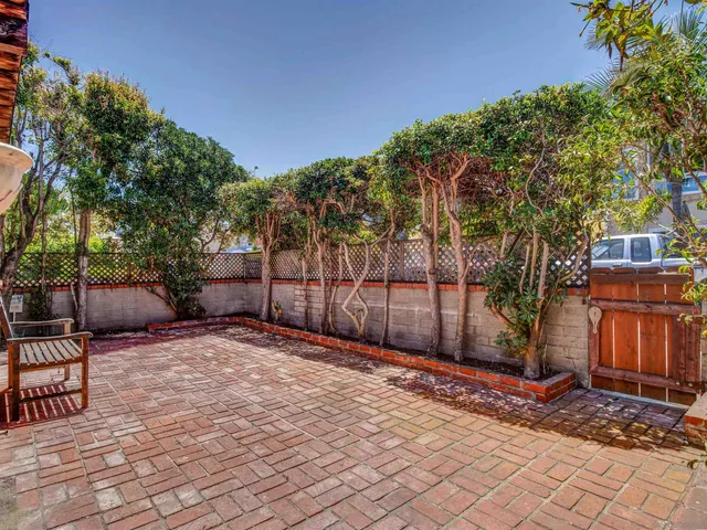 a backyard of a house with seating space
