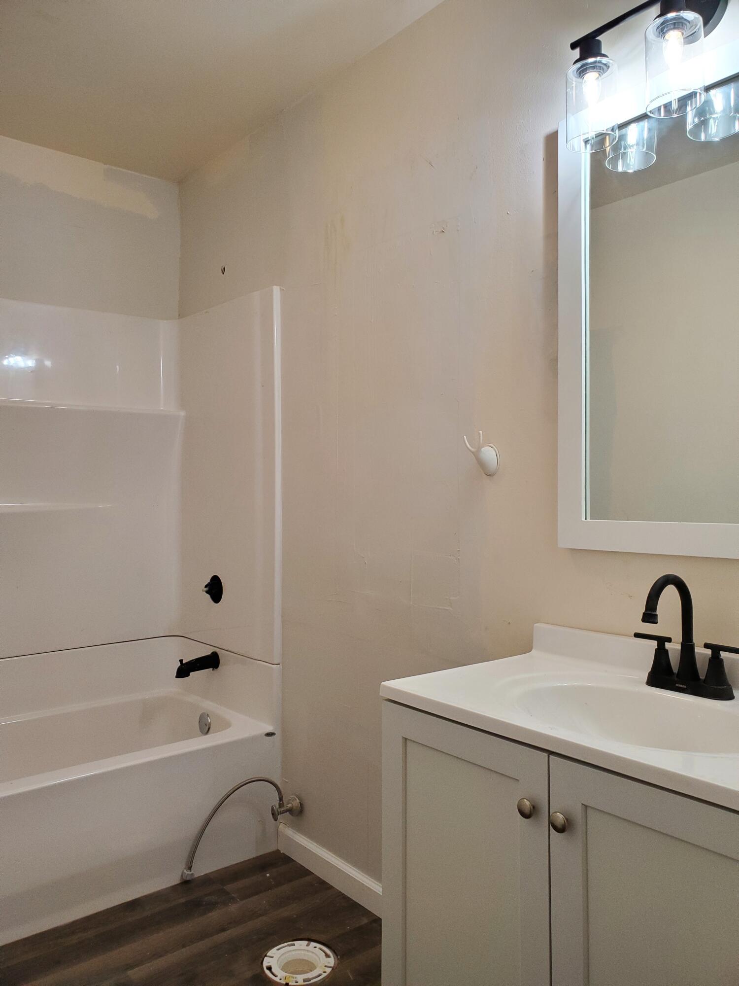 218 West Allen Street Kentland, IN 47951 - Photo 11 of 11 a bathroom with a sink and a bathtub