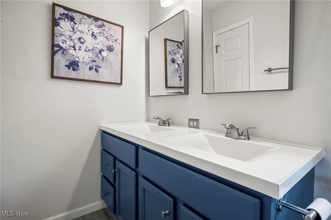 9230 Reed Road North Ridgeville, OH 44039 - Photo 31 of 48 Bathroom featuring double vanity