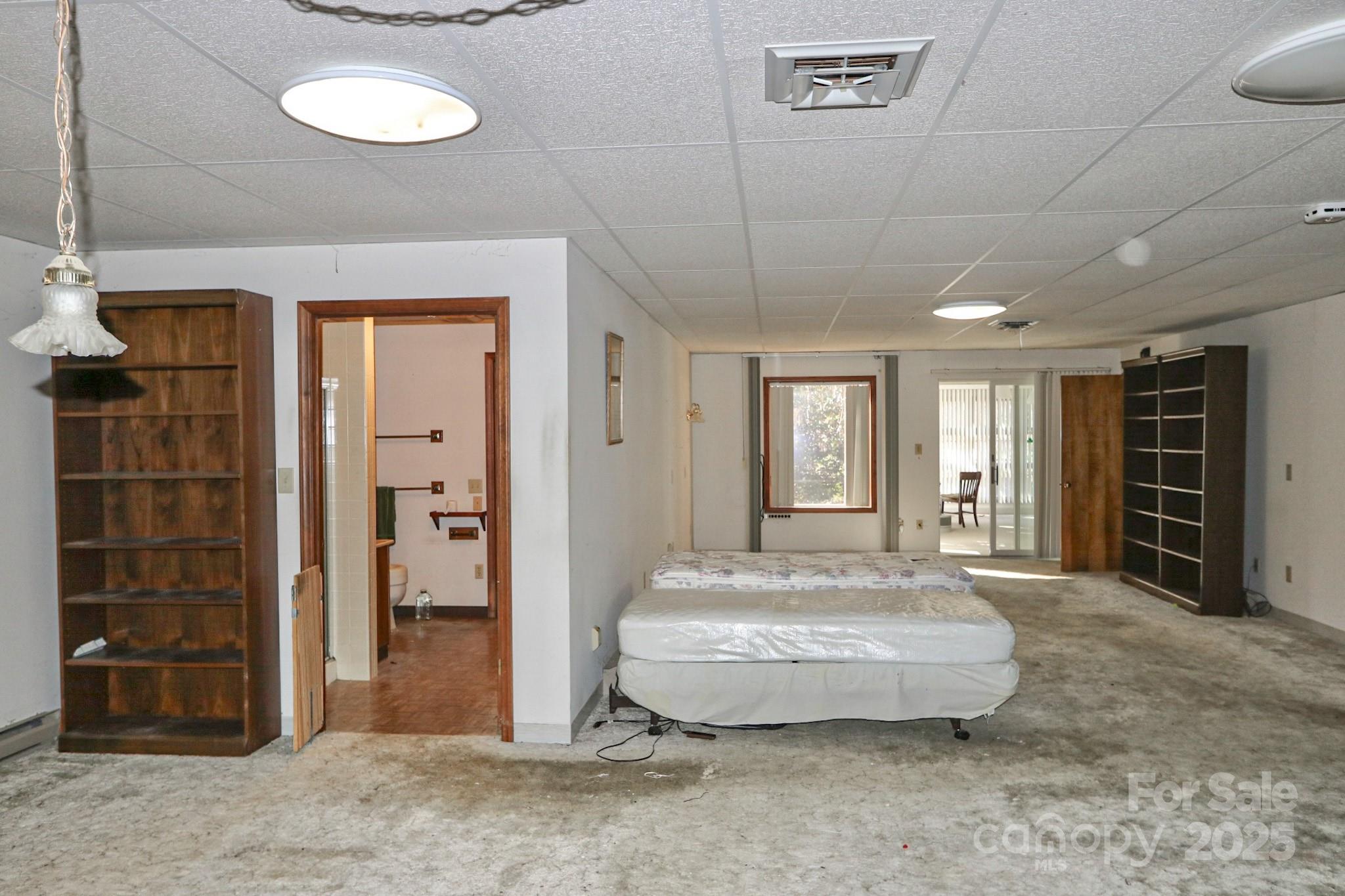 5313 Friendship Circle Road East Bend, NC 27018 - Photo 14 of 48 a spacious bedroom with a bed and a window