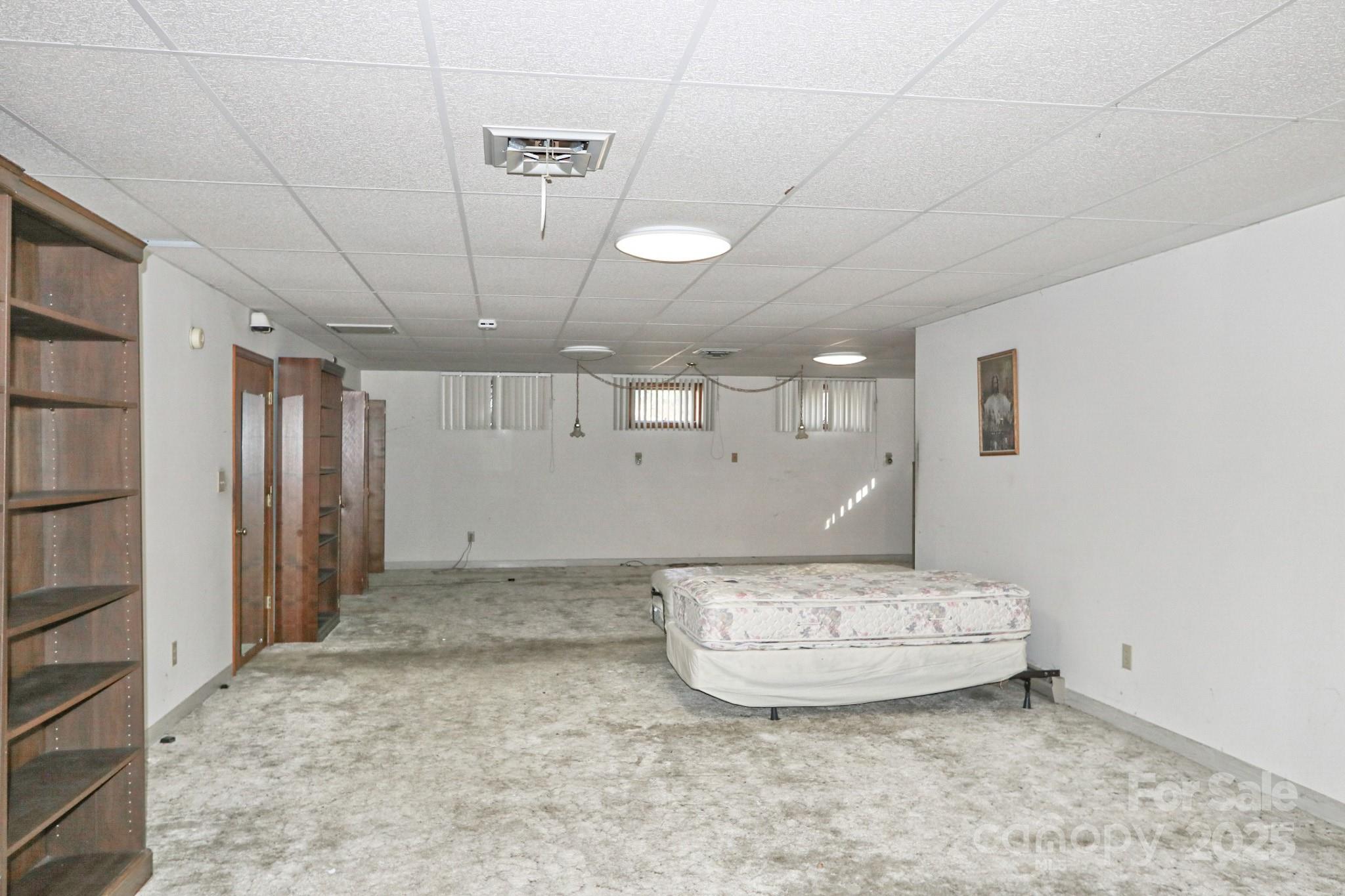 5313 Friendship Circle Road East Bend, NC 27018 - Photo 16 of 48 a view of a hallway with wooden shelves