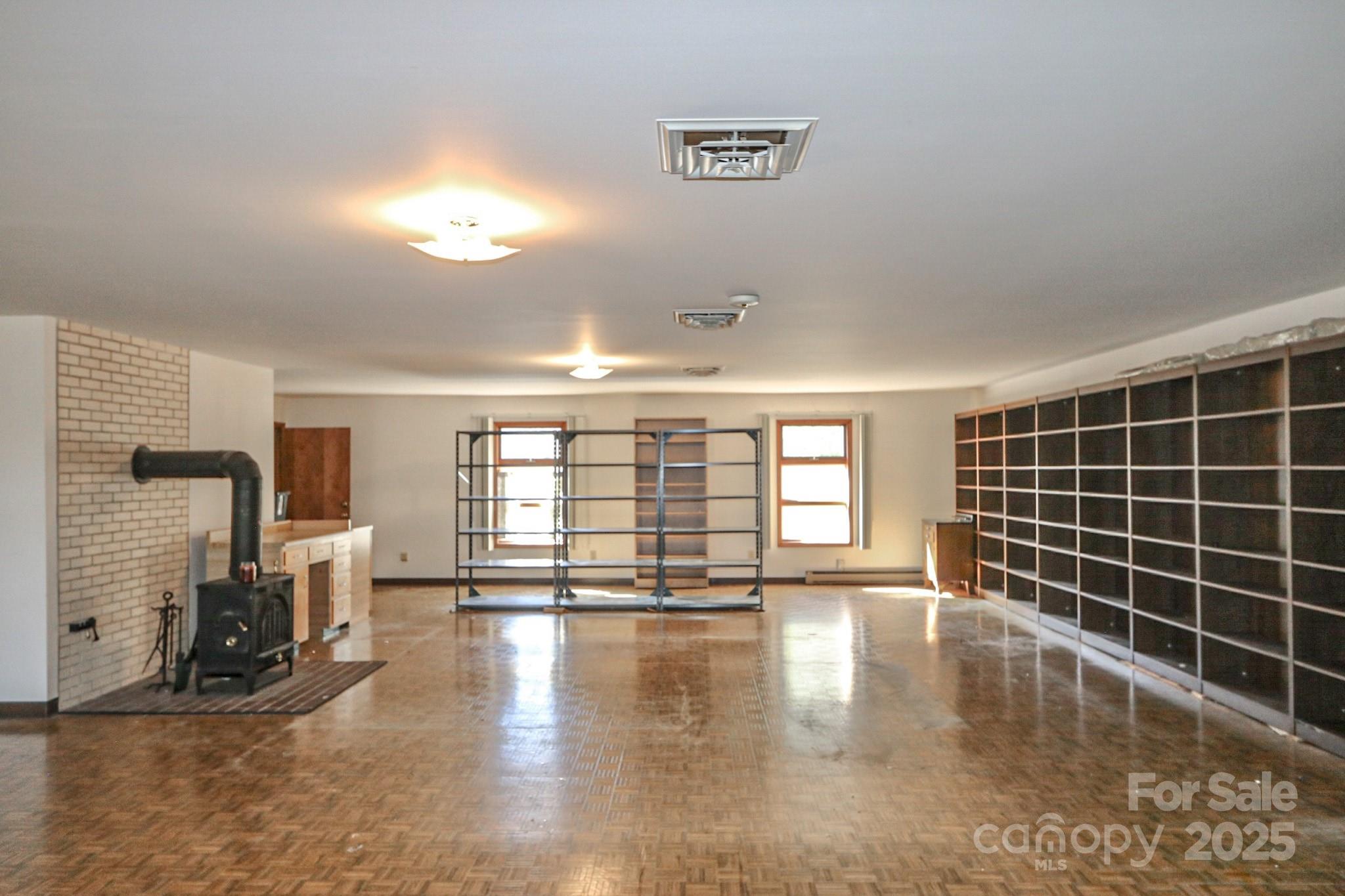 5313 Friendship Circle Road East Bend, NC 27018 - Photo 22 of 48 a view of empty room with wooden floor and fan