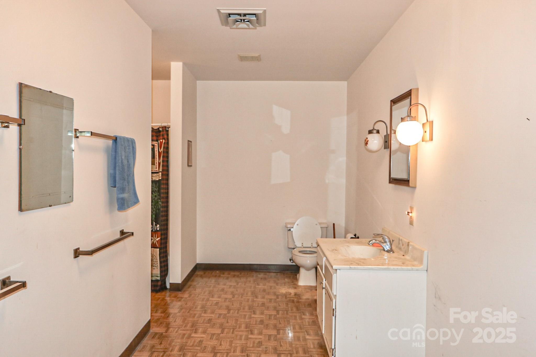5313 Friendship Circle Road East Bend, NC 27018 - Photo 26 of 48 a bathroom with a sink a mirror and shower