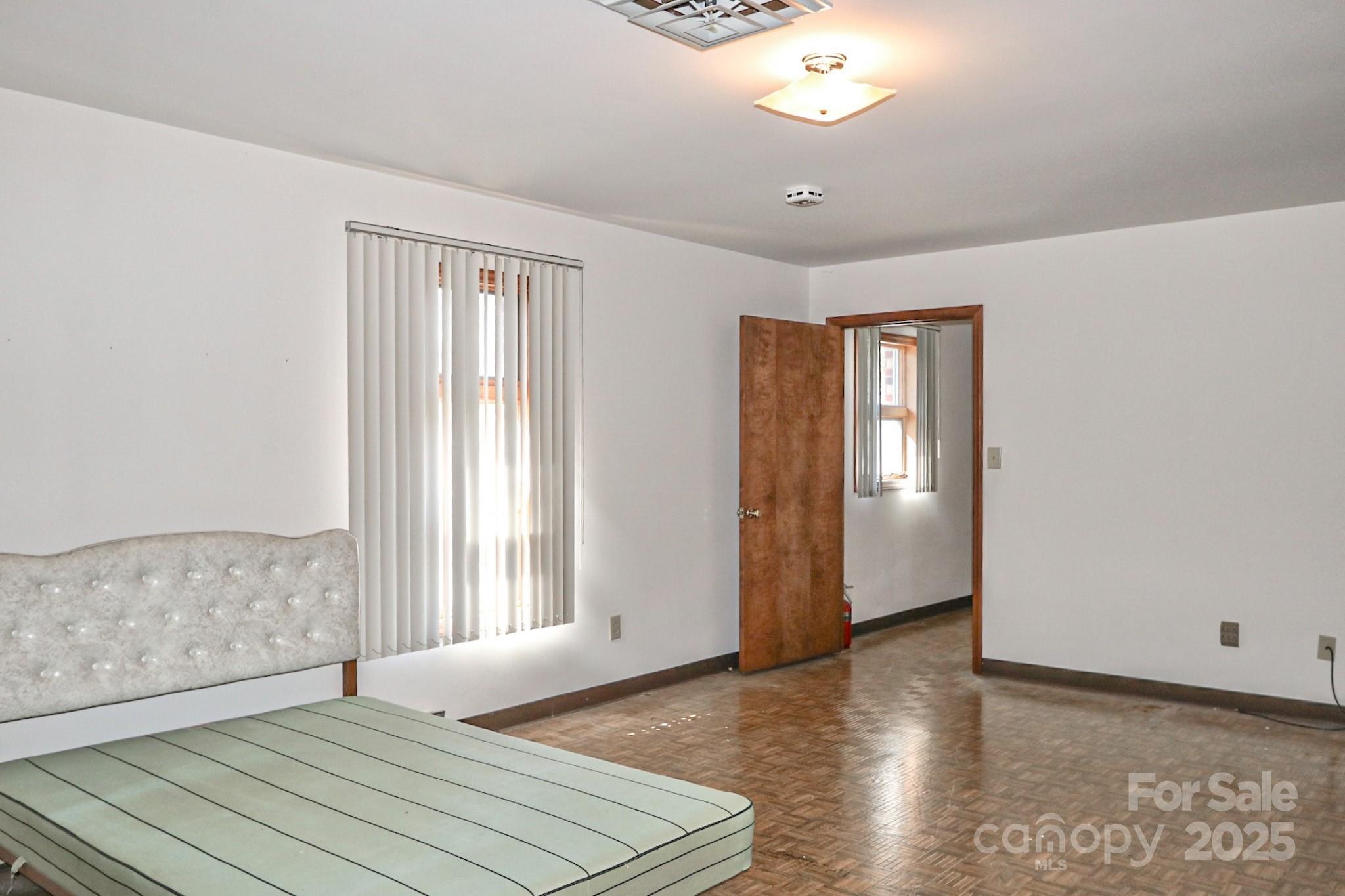 5313 Friendship Circle Road East Bend, NC 27018 - Photo 28 of 48 a view of an empty room with window and wooden floor