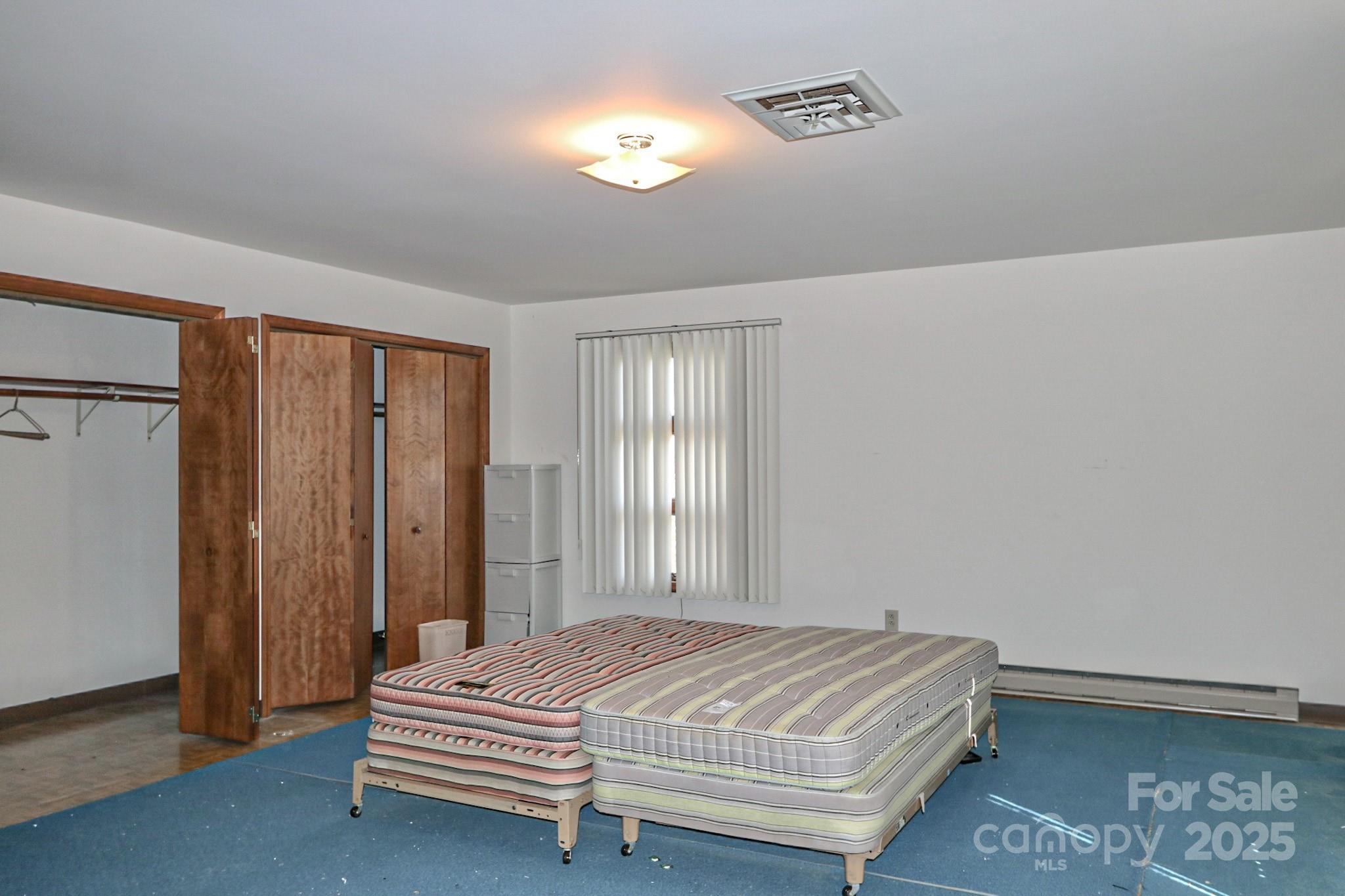 5313 Friendship Circle Road East Bend, NC 27018 - Photo 31 of 48 a bedroom with a bed and a window