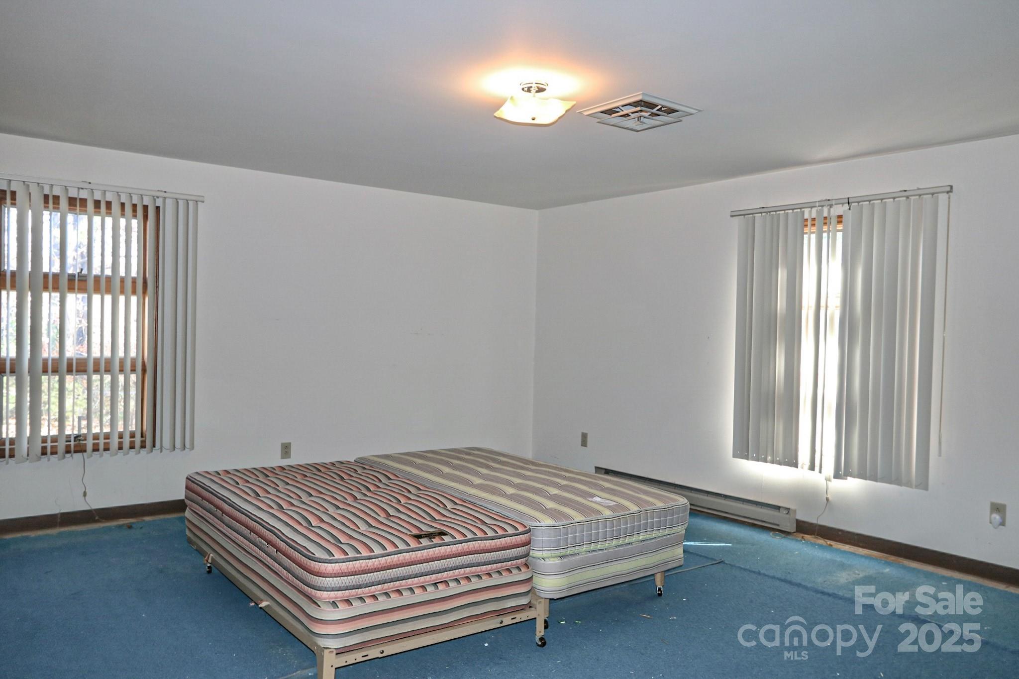 5313 Friendship Circle Road East Bend, NC 27018 - Photo 32 of 48 a bedroom with a bed and a window