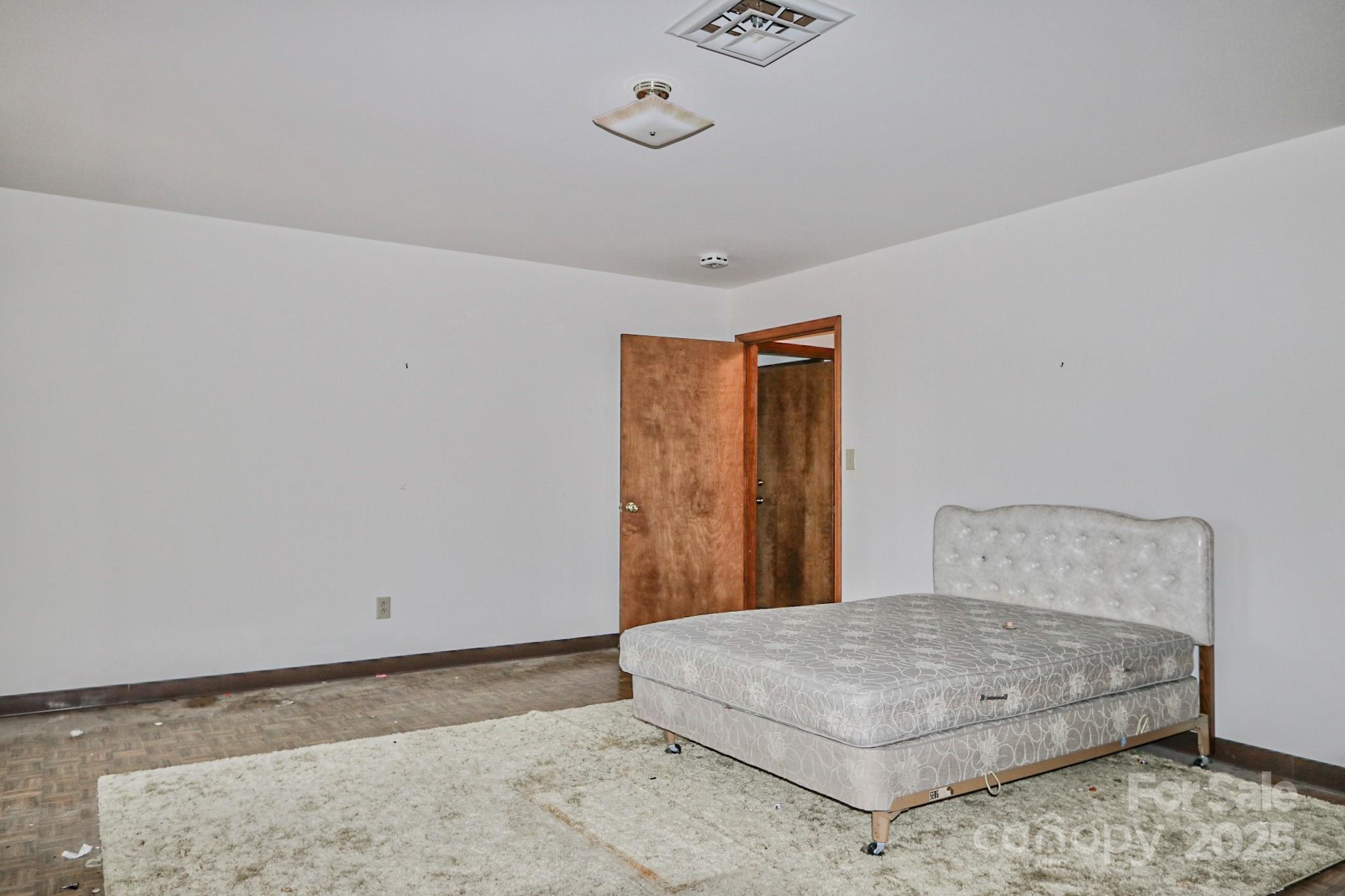 5313 Friendship Circle Road East Bend, NC 27018 - Photo 33 of 48 a bedroom with a bed and wooden floor